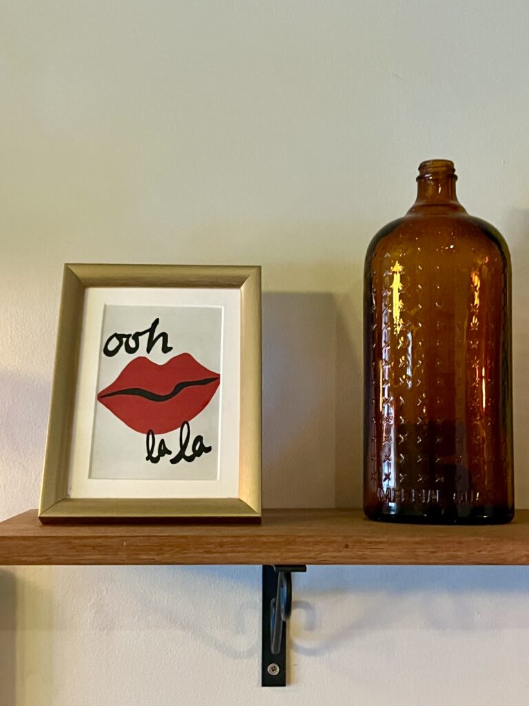 Ooh la la framed lip picture and vintage brown glass bottle