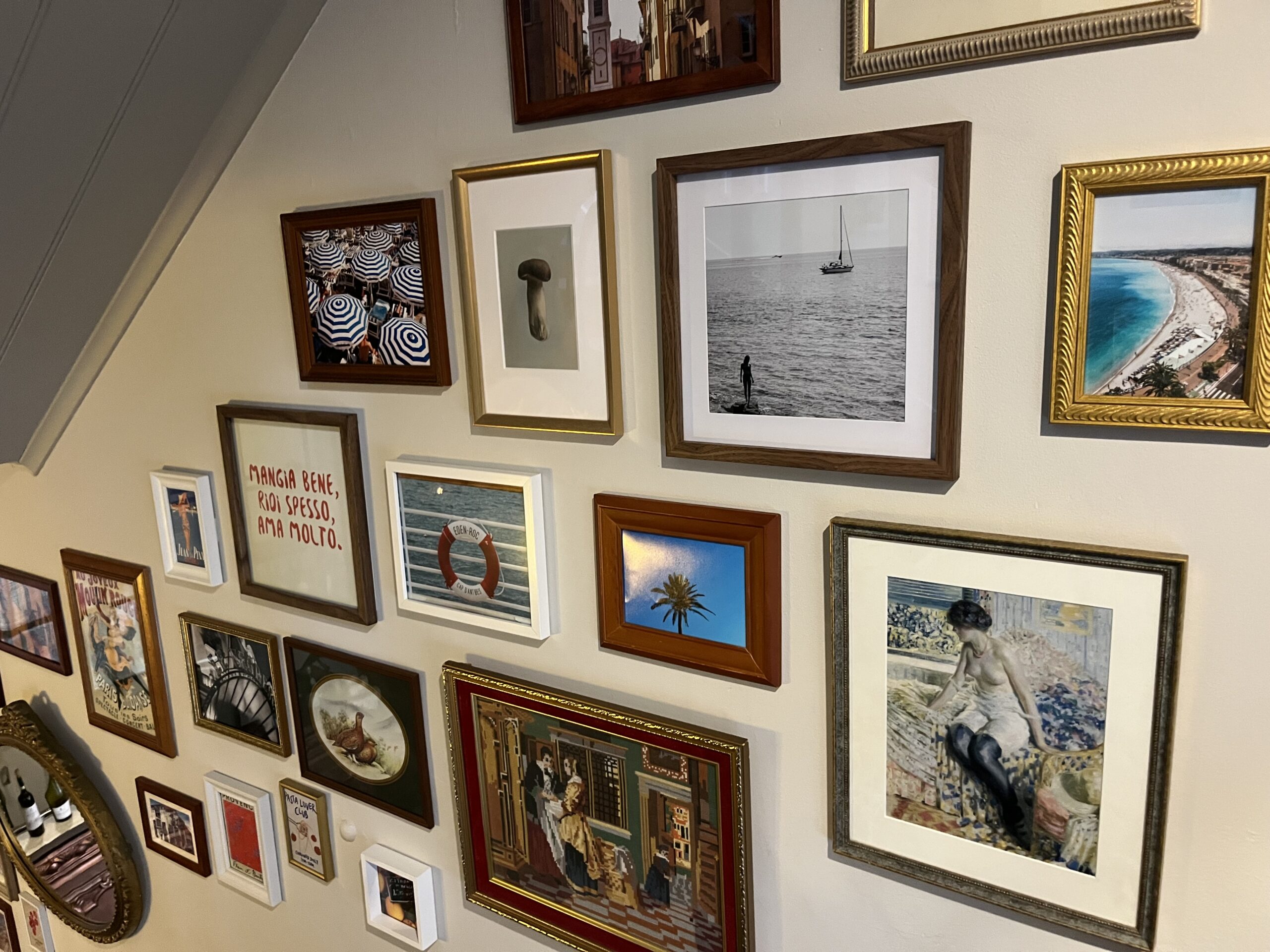 A collection of French artwork on a wall